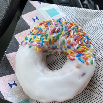 Donut Connection - a white frosted donut with sprinkles - Donuts Near Me - Beckley, West Virginia
