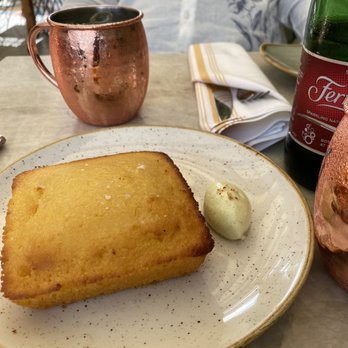 Red Rooster Overtown - Marcus' Cornbread cast iron cooked, spiced rum butter - Cocktail Bars Near Me - Miami, Florida Red Rooster Overtown - Marcus' Cornbread cast iron cooked, spiced rum butter - Cocktail Bars Near Me - Miami, Florida