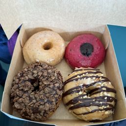 lemon donut, a jelly filled donut. chocolate flake cereal  donut , peanut butter glaze donut