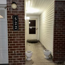 FedEx Office Print & Ship Center - My entrance and door, couriers could throw a package and it would still be on grass or the white concrete. His "proof" lends to MY proof.