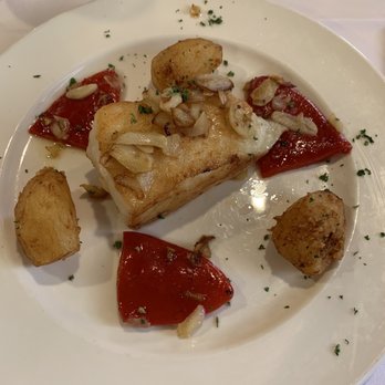 Casa Juancho - Sea Bass with garlic, potatoes, and red peppers. - Spanish Near Me - Miami, Florida