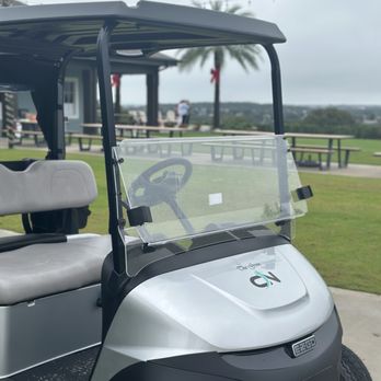 The View - a golf cart parked in a parking lot - Cocktail Bars Near Me - Clermont, Florida