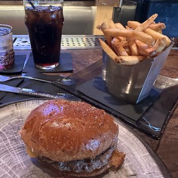 HOLSTEINS - HH hour 3-6 Mon-Fri $16 hamburger, fries and drink. I already ate half my burger in the photo. - Burgers Near Me - Las Vegas, Nevada HOLSTEINS - HH hour 3-6 Mon-Fri $16 hamburger, fries and drink. I already ate half my burger in the photo. - Burgers Near Me - Las Vegas, Nevada