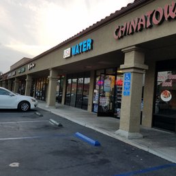 a car parked in front of a store a car parked in front of a store