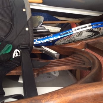 AK Movers - Golf clubs and tennis racquet on top of unprotected antique wood chair. - Movers Near Me - Rockville, Maryland