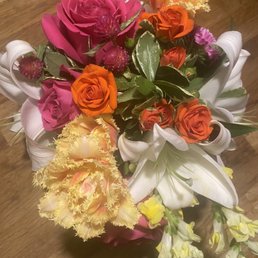 Recent arrangement with lilies, snap dragons, spray roses, roses, fancy tulips, and more!