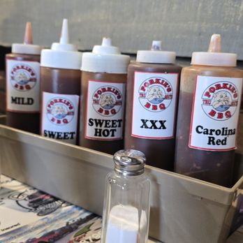 Porkies BBQ - 5 of the 7 sauces, these are on all tables the others are OMG (ghost pepper) and Afterburner and these two are on the counter - Barbeque Near Me - DeLand, Florida Porkies BBQ - 5 of the 7 sauces, these are on all tables the others are OMG (ghost pepper) and Afterburner and these two are on the counter - Barbeque Near Me - DeLand, Florida