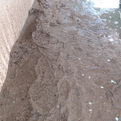 Tenney Mtn Car Wash - Here's two inches of mud you have to walk through on the sides while washing your car. It's July! Clearly no one cleaned up since winter...