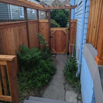Riggins Construction - Fence with trellis and gate. They preserved most of the plants! - Fences & Gates Near Me - Seattle, Washington Riggins Construction - Fence with trellis and gate. They preserved most of the plants! - Fences & Gates Near Me - Seattle, Washington