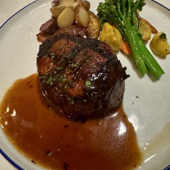 Whitestone Restaurant & Bar - Steak, with sauce, potatoes, broccoli and carrots on a white plate on a white tablecloth - New American Near Me - Dana Point, California Whitestone Restaurant & Bar - Steak, with sauce, potatoes, broccoli and carrots on a white plate on a white tablecloth - New American Near Me - Dana Point, California