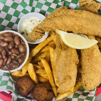 The Twisted Pickle - Our Hand battered Catfish served with mouth watering homemade beans n' fries, with 2 hushpuppies. - Pizza Near Me - Blue Ridge, Texas The Twisted Pickle - Our Hand battered Catfish served with mouth watering homemade beans n' fries, with 2 hushpuppies. - Pizza Near Me - Blue Ridge, Texas