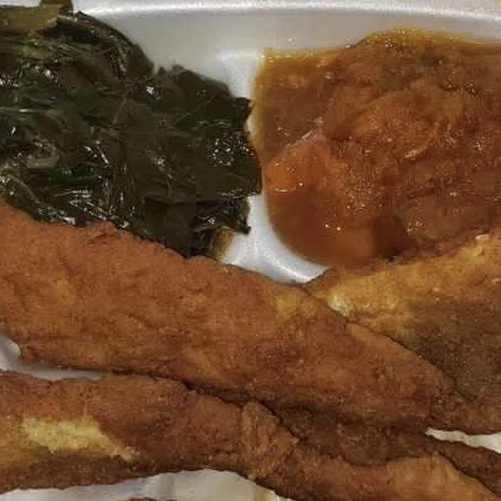 Fried fish with yams and greens. It actually came with 4 pieces of fish. Fried fish with yams and greens. It actually came with 4 pieces of fish.