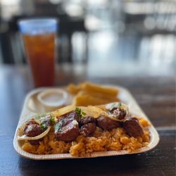 Cubanissimo Cuban Coffee House & Cafe - Puerco Frito with side of yucca fries o
