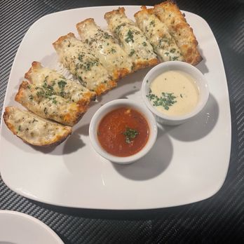 Italy In Town - Dipping bread appetizer. If you're a fan of garlic this is the choice for you. The bread is rich with garlic. - Italian Near Me - Benton, Arkansas Italy In Town - Dipping bread appetizer. If you're a fan of garlic this is the choice for you. The bread is rich with garlic. - Italian Near Me - Benton, Arkansas