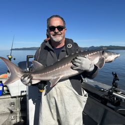 Astoria Fishing Charters and Guide Service - My dad with a Sturgeon!