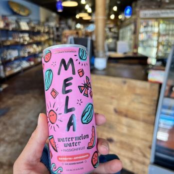 High Tide Bottle Shop And Kitchen - a hand holding a can of mela - Pizza Near Me - Coronado, California