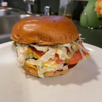 Taystee's Burgers - Ali's Notch-Yo-Burger - Grilled Onions, Jalapeño, American, Swiss, Pepper Jack, Nacho Cheese, Beef, Bacon, Nacho Doritos, Mayo, Hot Sauce - Burgers Near Me - St. Clair Shores, Michigan
