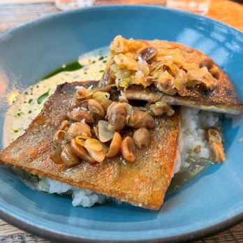 Husk - Confit Chicken Wings (Alabama White Sauce) and Bucksnort Trout (Carolina Gold Rice, Green Garlic, Peanut, Ginger), Garden View - Southern Near Me - Nashville, Tennessee