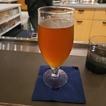 The Commentary - a glass of beer on a table - Bars Near Me - Arlington, Virginia The Commentary - a glass of beer on a table - Bars Near Me - Arlington, Virginia