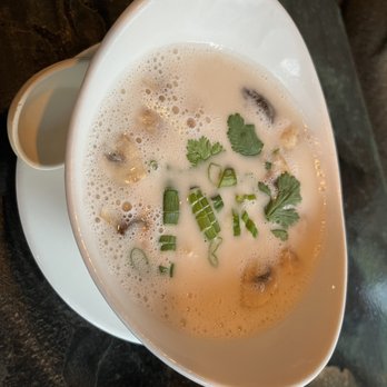 Bedford Thai - Tom kha gai-chicken coconut soup with mushroom, tomato, scallion, & cilantro - Thai Near Me - Stamford, Connecticut Bedford Thai - Tom kha gai-chicken coconut soup with mushroom, tomato, scallion, & cilantro - Thai Near Me - Stamford, Connecticut