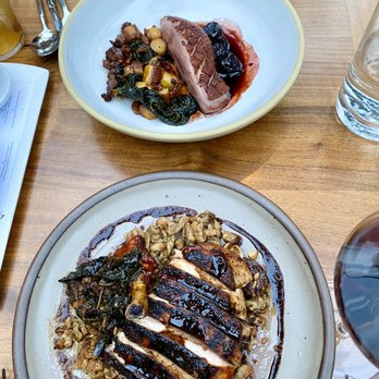 Redbird - Liberty Farms Duck (top) and Red Wattle Pork Chop with spaetzle - New American Near Me - Los Angeles, California Redbird - Liberty Farms Duck (top) and Red Wattle Pork Chop with spaetzle - New American Near Me - Los Angeles, California