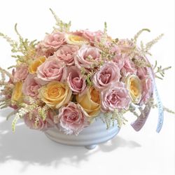Roots & Blooms - Sunlit Blush -Soft pink and cheerful yellow roses bloom together in a crisp white vase, capturing the warmth of sunshine and the sweetness.