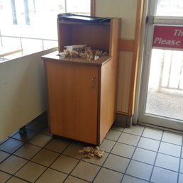 Trash can in front of the food bar