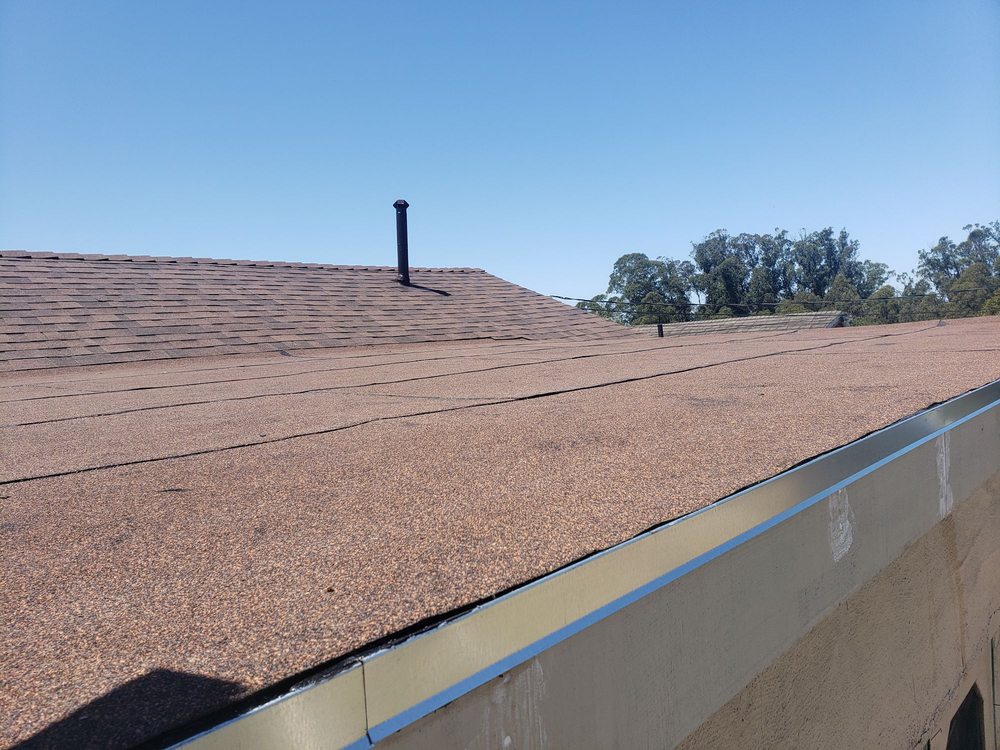 Slide of T J Roofing