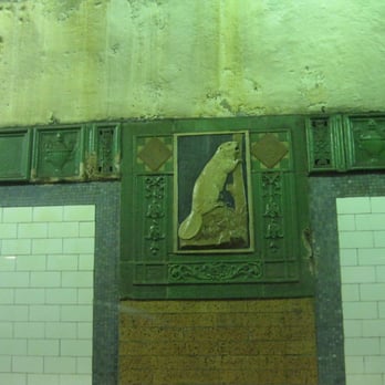 MTA - Astor Place Subway Station - The beaver plaques throughout the station are a symbol of John Jacob Astor's fortune, which was based on the fur trade. - Metro Stations Near Me - New York, New York MTA - Astor Place Subway Station - The beaver plaques throughout the station are a symbol of John Jacob Astor's fortune, which was based on the fur trade. - Metro Stations Near Me - New York, New York