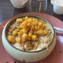 Peaches and cream oatmeal with farro. Peaches and cream oatmeal with farro.