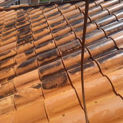 Fully Restored Pressure Washing - Clay tile roof cleaning up nicely