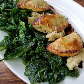 The View Restaurant - Empanadas on a bed of flash fried spinach leaves and artichoke. - New American Near Me - Estes Park, Colorado The View Restaurant - Empanadas on a bed of flash fried spinach leaves and artichoke. - New American Near Me - Estes Park, Colorado