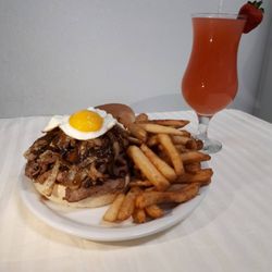 Toby's Diner - Shredded Beef Sandwich, Topped with Beef Gravy and Sunny Side Egg and served with a choice of a Side For $10.99
