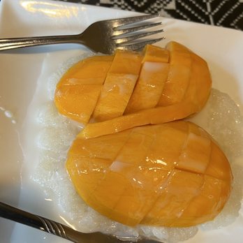 Thai Orchid Restaurant - two slices of mango on rice - Thai Near Me - Charlotte, North Carolina Thai Orchid Restaurant - two slices of mango on rice - Thai Near Me - Charlotte, North Carolina