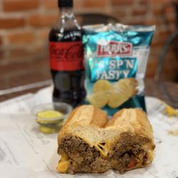Jim's South St - Cheese Steak w Whiz, Onions, & Sweet Peppers (~$16), 20oz Soda Bottle (~$3), Chips (~$1), & Pickles (free)