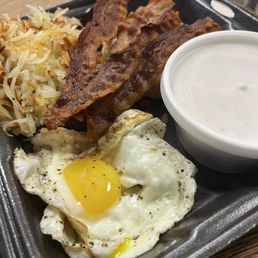 Eggs, hash browns, bacon, biscuit and gravy Eggs, hash browns, bacon, biscuit and gravy