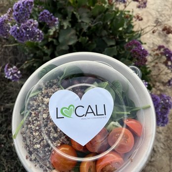 Locali - a person holding a bowl of vegetables - Sandwiches Near Me - San Diego, California