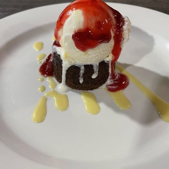 Challenger Tap House - Brownie Cheesecake with ice cream and Strawberry Purée - Sports Bars Near Me - Lancaster, California Challenger Tap House - Brownie Cheesecake with ice cream and Strawberry Purée - Sports Bars Near Me - Lancaster, California