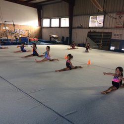 Pacific Gymnastics - Beginner class working on splits