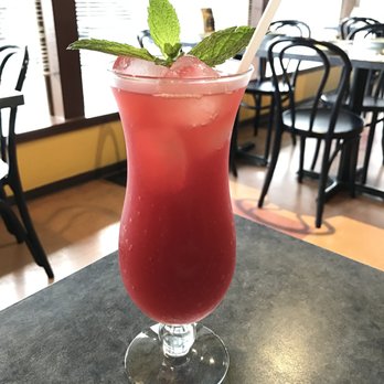 Pad Thai Restaurant - a red drink with a mint leaf garnish - Thai Near Me - Pitt Meadows, British Columbia Pad Thai Restaurant - a red drink with a mint leaf garnish - Thai Near Me - Pitt Meadows, British Columbia