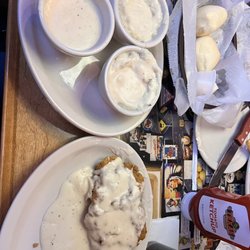 Texas Roadhouse - Country fried chicken with two sides of mashed potatoes and gravy and an extra gravy
