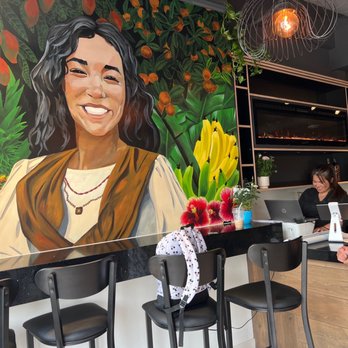 Mad Grizzly - Owner Dianna and Customer Reggi and welcome mural. - Breakfast & Brunch Near Me - Jasper, Alberta