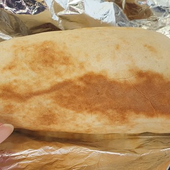 Mike's Shawarma - a hand holding a piece of bread - Lebanese Near Me - Newmarket, Ontario