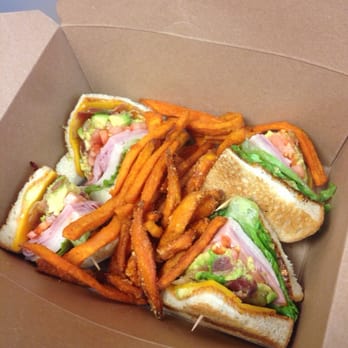 The Tavern - To go club sammie with sweet potato fries! - Sports Bars Near Me - Austin, Texas