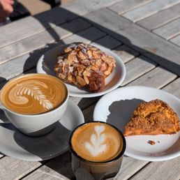 Cappuccino, cortado, almond croissant, and scone