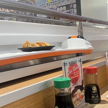 Happy Sushi SF - Food riding on train - Sushi Bars Near Me - Spanish Fort, Alabama
