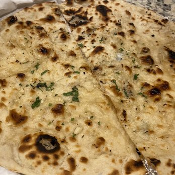 Passage To India Indian Cuisine - Garlic Naan - Indian Near Me - Charlotte, North Carolina Passage To India Indian Cuisine - Garlic Naan - Indian Near Me - Charlotte, North Carolina