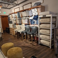Creative Interiors & Design - Lots of different throw pillows, and samples of varying firmness chair and sofa cushioning materials
