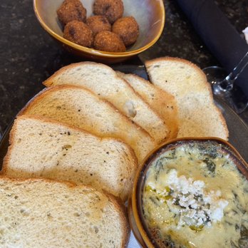 Curio Bistro - Spinach Artichoke dip with Feta cheese and a side of jalapeño hush puppies - Cajun/Creole Near Me - New Orleans, Louisiana