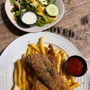 The Tin Cup Tavern - Fried white fish battered in corn meal & seasoning. Served over crispy fries & fresh side salad. - Bars Near Me - Campbell, Texas The Tin Cup Tavern - Fried white fish battered in corn meal & seasoning. Served over crispy fries & fresh side salad. - Bars Near Me - Campbell, Texas